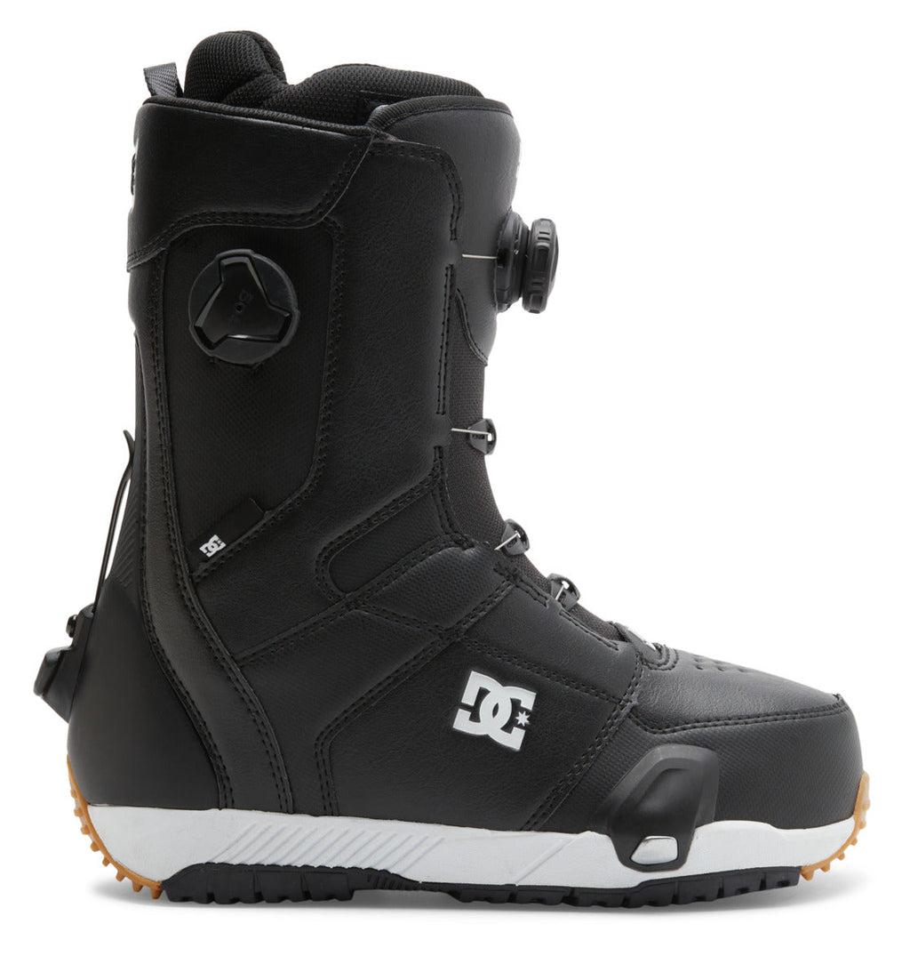 A black Men’s Control Step On BOA® Snowboard Boot by DC Shoes, featuring a white logo, rugged rubber sole, and Dual Zone BOA® Fit System for precise adjustment, shown in profile on a white background.
