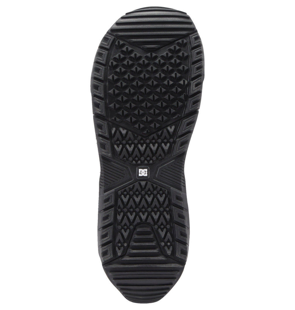Bottom view of a black DC Shoes Men’s Control Step On BOA® Snowboard Boot sole featuring patterned tread, geometric textures, and a small DC logo at the center—highlighting the snow boot innovation characteristic of Step On Boot designs.