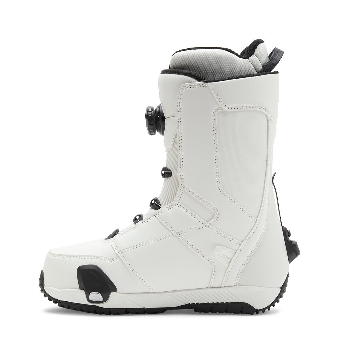 A side profile view of the DC Shoes Men’s Control Step On® Snowboard Boot in white with black accents, featuring a Dual Zone BOA Fit System for precise lacing and a textured sole, highlighting snow boot innovation, isolated on a white background.