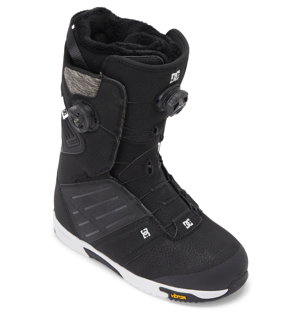 The Men’s Judge BOA® Snowboard Boots by DC Shoes come in black with textured panels, offering precise tightening through a Dual Zone BOA® Fit System, a plush inner lining for comfort, and a white Vibram sole.