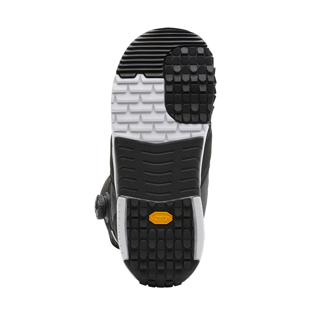 Black shoe sole with a yellow Vibram logo, showcasing black and white tread patterns for enhanced grip, viewed from the bottom against a white background—designed specifically for DC Shoes Men’s Judge BOA® Snowboard Boots and compatible with the Dual Zone BOA® Fit System.