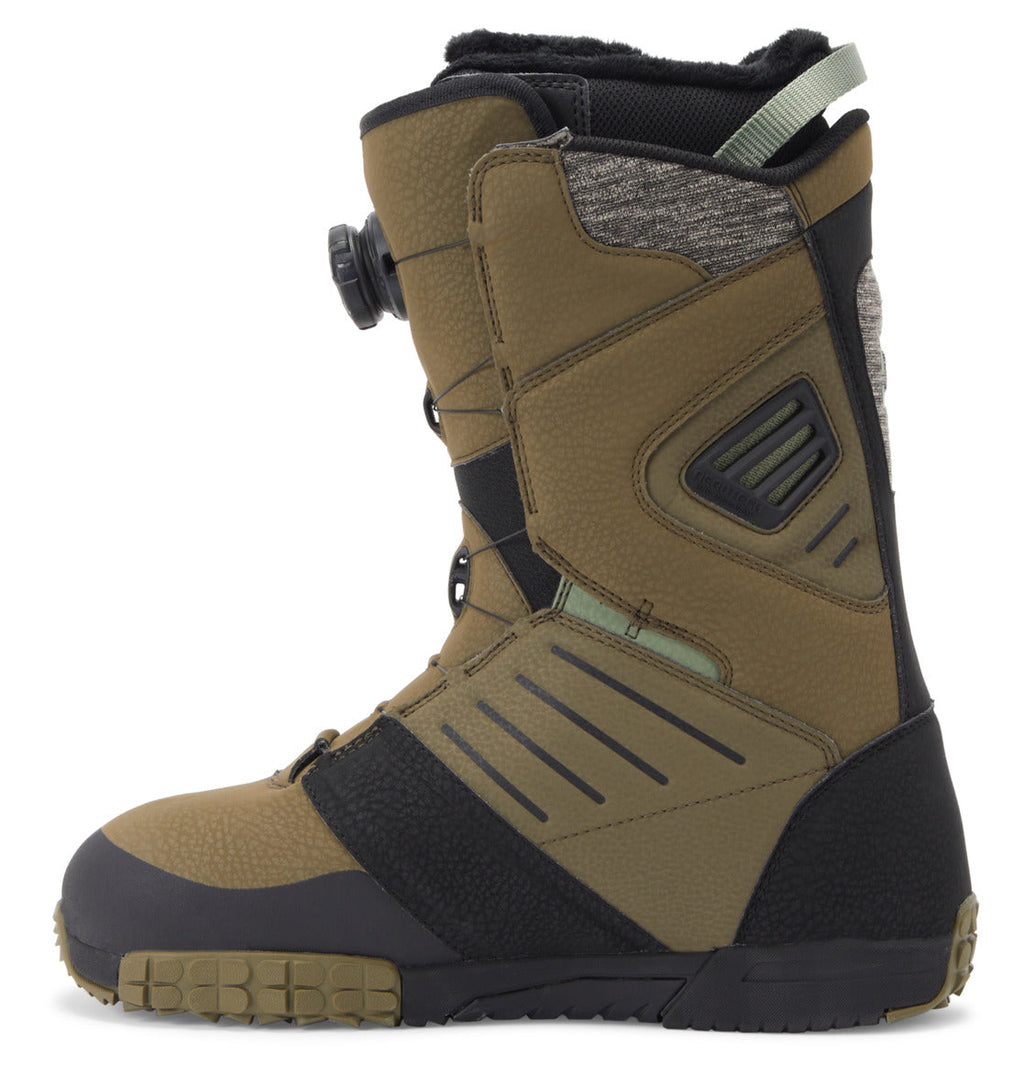 Men’s Judge BOA® Snowboard Boot by DC Shoes in olive green with black accents, featuring a textured Vibram outsole for superior grip, a Dual Zone BOA® Fit System for precise front tightening, and gray padded lining. Displayed in side profile against a white background.
