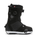 A side-profile image of the DC Shoes Men’s Judge Step On® Snowboard Boots is shown in black with a white sole, featuring the Dual Zone BOA Fit System lacing, distinctive side detailing, and padded ankle support against a white background.