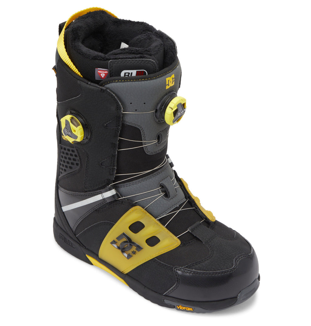 Black and yellow Men’s Phantom BOA® Snowboard Boots by DC Shoes, featuring dual BOA® Fit System dials, the DC Shoes logo on the side, and a Vibram sole. Designed with PrimaLoft insulation for enhanced warmth, these boots include grey panels, metal laces, and a padded interior visible at the top.