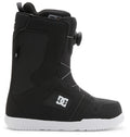 The DC Shoes Men’s Phase BOA® Snowboard Boot is shown in profile facing left against a white background, featuring a black design with IMPACT-ALG insoles, a white sole, side DC logo, and the BOA Fit System dial tightening system.
