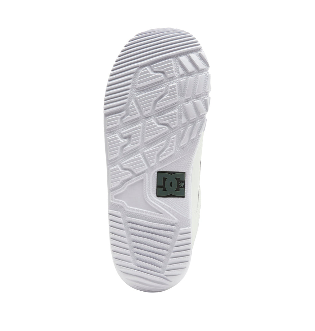 White sneaker outsole with geometric tread patterns and a black DC Shoes logo near the heel area, as seen from directly below—a design inspired by the traction on DC Shoes Men’s Phase BOA® Snowboard Boots, which feature innovative technologies like the BOA Fit System.