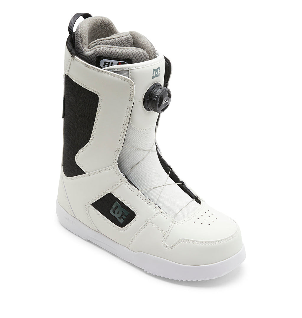 Men’s Phase BOA® Snowboard Boots by DC Shoes in white and black, featuring the DC logo on the side, a high-top design for ankle support, and the BOA® Fit System twist dial lacing, displayed against a plain white background.