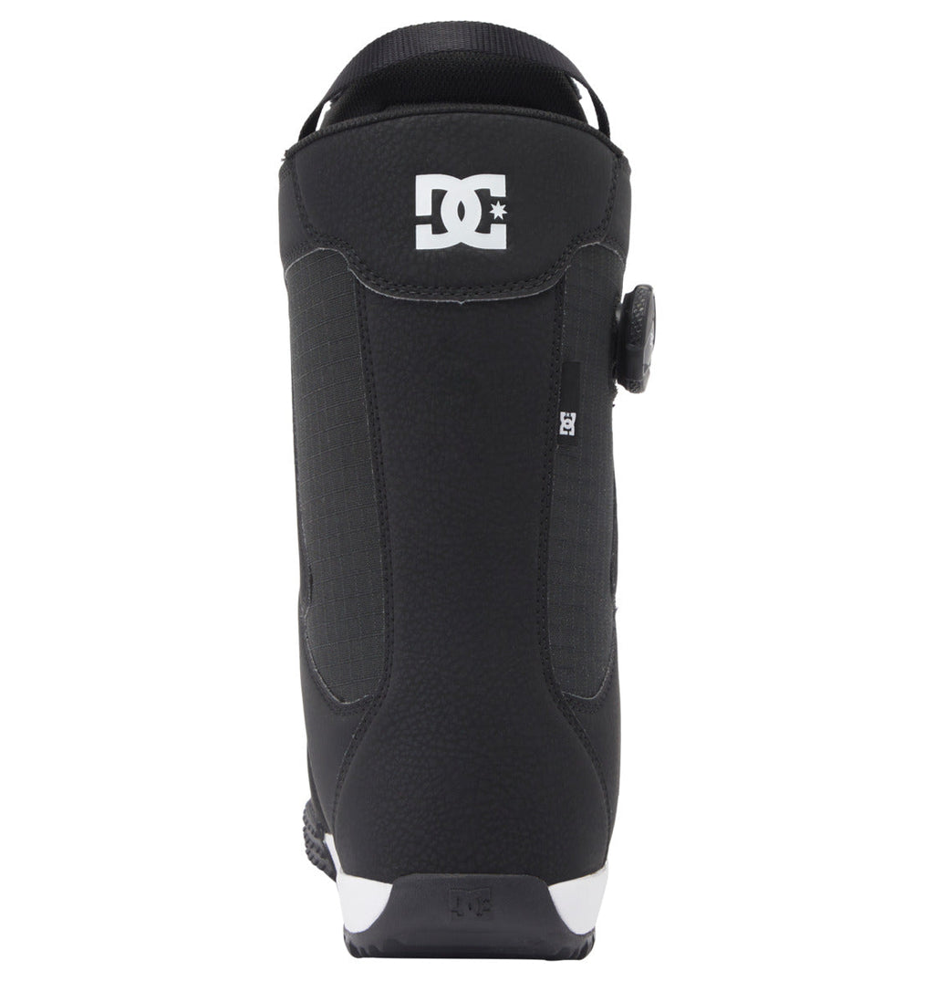 Men’s Phase Pro BOA® Snowboard Boot by DC Shoes in black, shown from the back with the white DC Shoes logo at the top and a round adjustment dial on the side. The textured sole and heel provide extra grip, while PrimaLoft® insulation keeps feet warm and comfortable on the slopes.