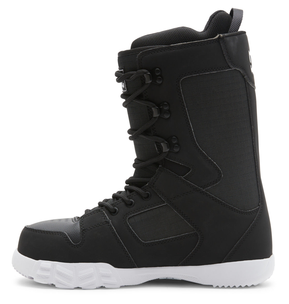 The DC Shoes Men’s Phase Lace Snowboard Boots are shown in a side view, featuring a black upper with a contrasting white sole. These boots offer medium flex for balanced support, utilize black laces with traditional lace closure through metal eyelets, and include reinforced stitching along with a pull tab on the heel. The design is modern and sturdy.
