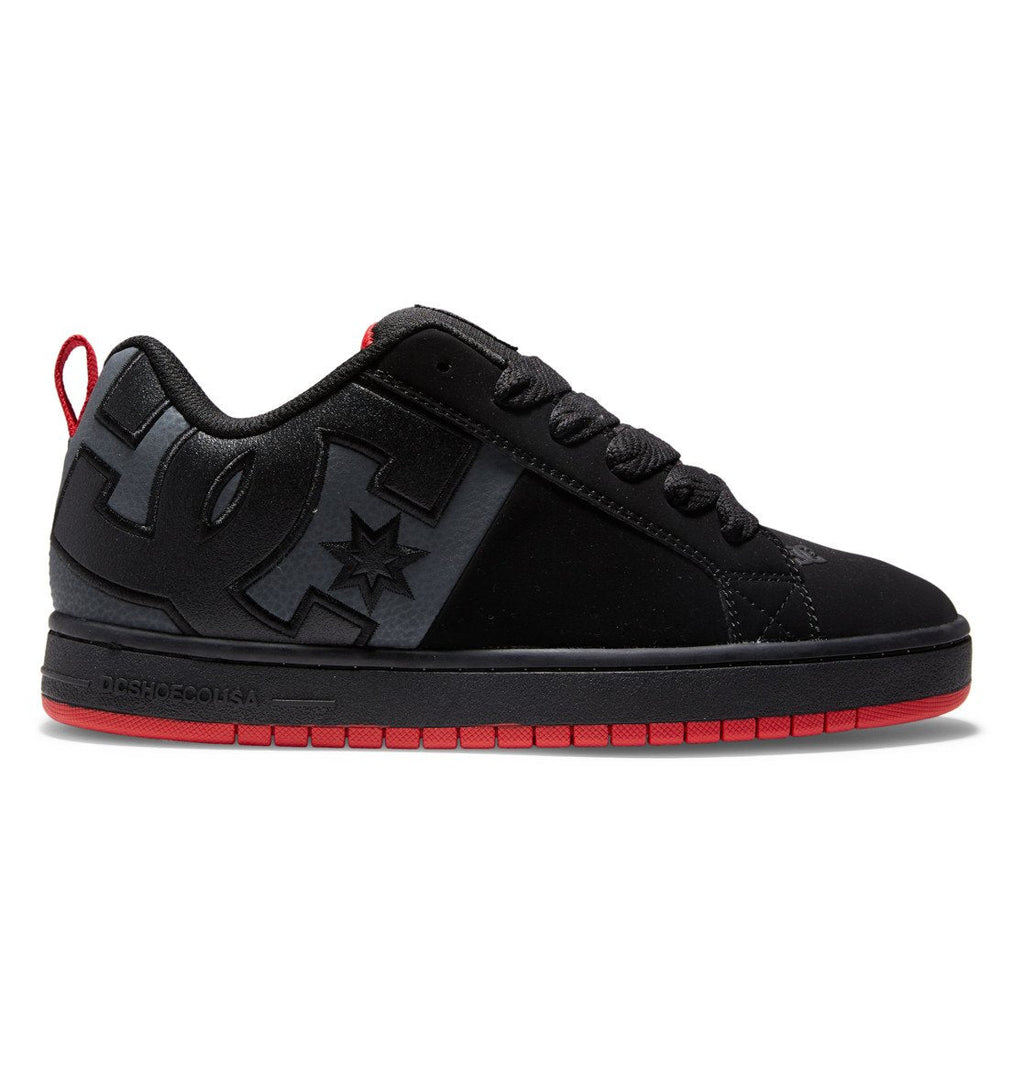 The Men’s Court Graffik Shoes by DC Shoes showcase a puffy silhouette in black with striking red accents, complemented by black laces and a thick sole for enhanced comfort and style. The iconic DC Star Logo is prominently displayed on the side, while the low-top design makes these shoes a standout option in men’s footwear.