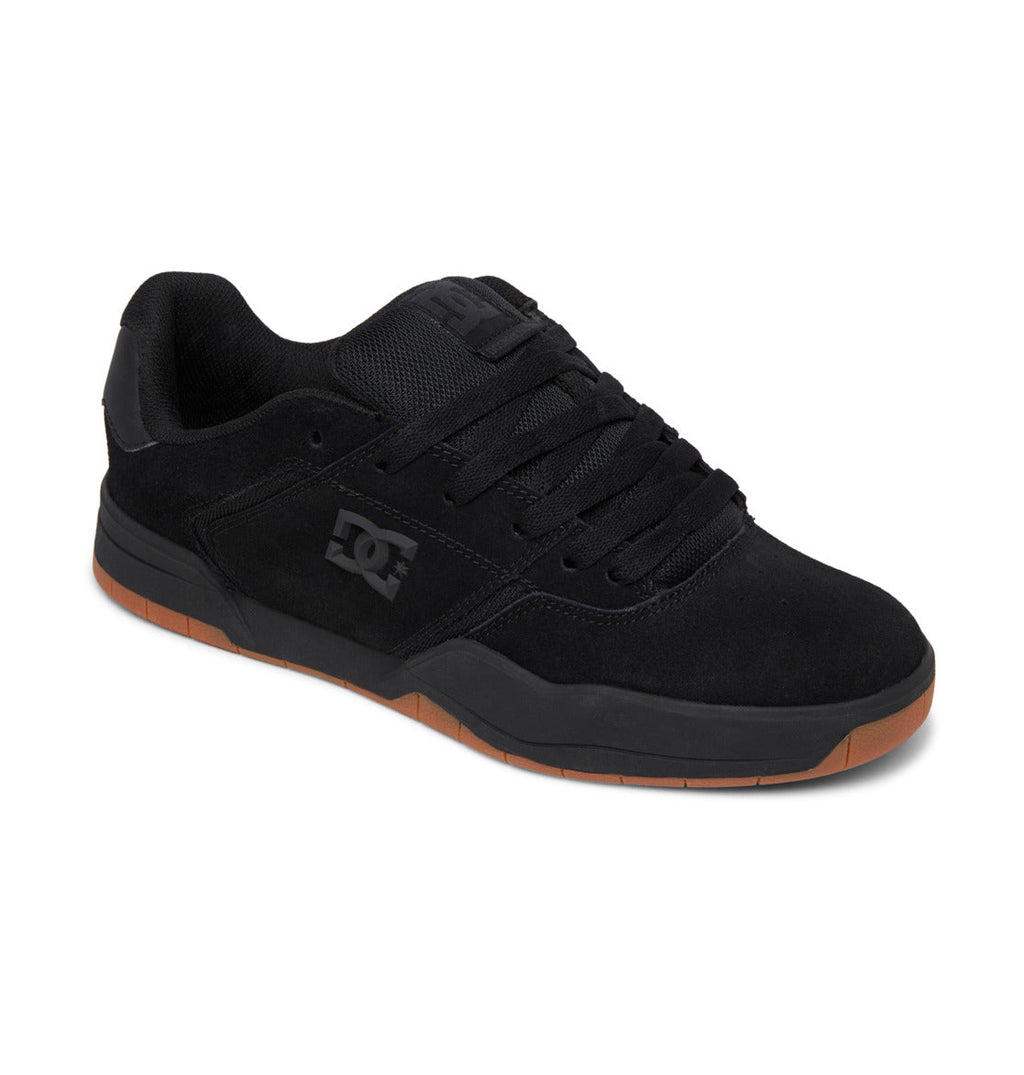 The Men’s Central Shoes by DC Shoes are durable black skate shoes featuring a gum cupsole, thick black laces, and a low-cut design. This classic style is displayed at an angle on a white background.