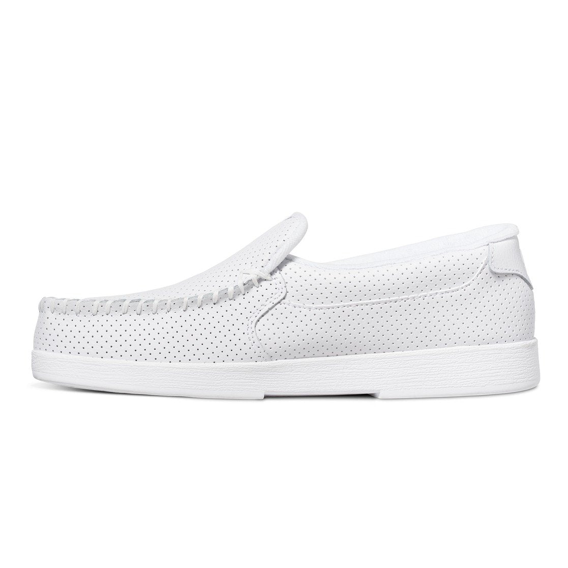 The DC Shoes Men’s Villain Slip-On Shoes, featuring a white perforated design and a textured sole for added grip, are shown in a side profile on a white background. These lightweight casual loafers have a low heel and an easy slip-on construction.