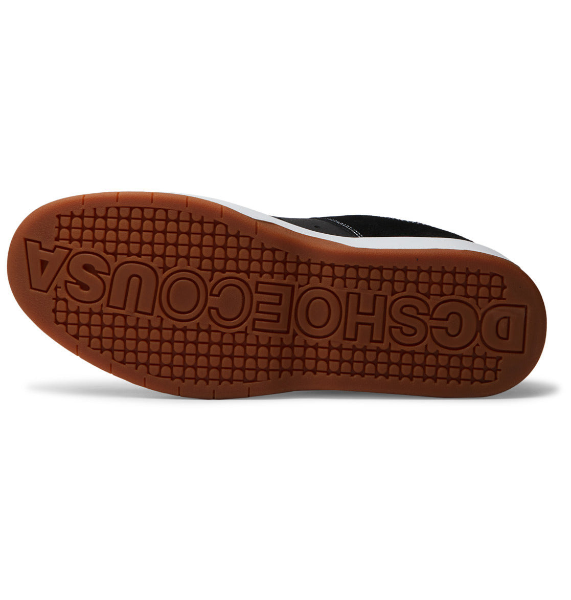 The sole of the Men’s Lynx Zero Shoes by DC Shoes features a brown, textured bottom with “DCSHOECOUSA” embossed along its length. The upper of this iconic skate shoe showcases a black and white design.