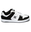 The Men’s Manteca 4 Shoes from DC Shoes feature a classic black and white design with a white sole, black suede accents, white laces, and the iconic DC logo on both the side and tongue, offering modern comfort for skateboarding and everyday wear.