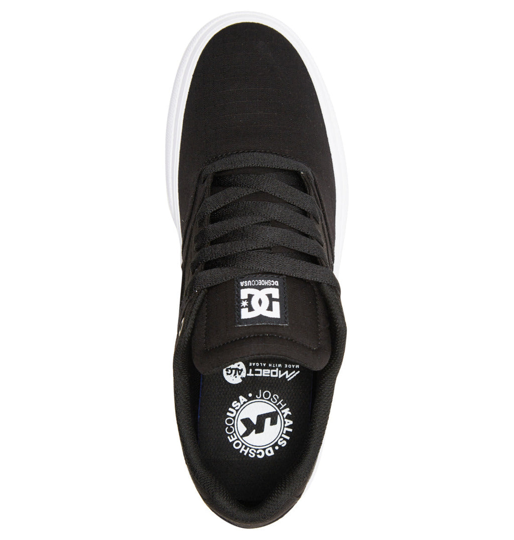 Men’s Manteca 4 Skate Shoes by DC Shoes are showcased from an overhead angle, featuring black laces, a sturdy cupsole with a white sidewall, and the signature DC logo displayed on both the tongue and insole. Crafted for exceptional style and performance, these sleek new sneakers come equipped with impact protection insoles to ensure lasting comfort throughout every skate session. The shoes are presented against a clean white background.