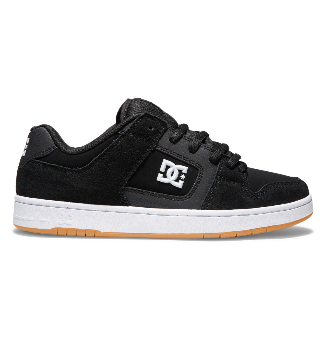 The image displays the DC Shoes Men’s Manteca 4 Skate Shoes in black, featuring a white DC logo on the side, black laces, a durable cupsole, white midsole, and a light brown gum outsole with added impact protection insoles, shown in a side profile view against a white background.