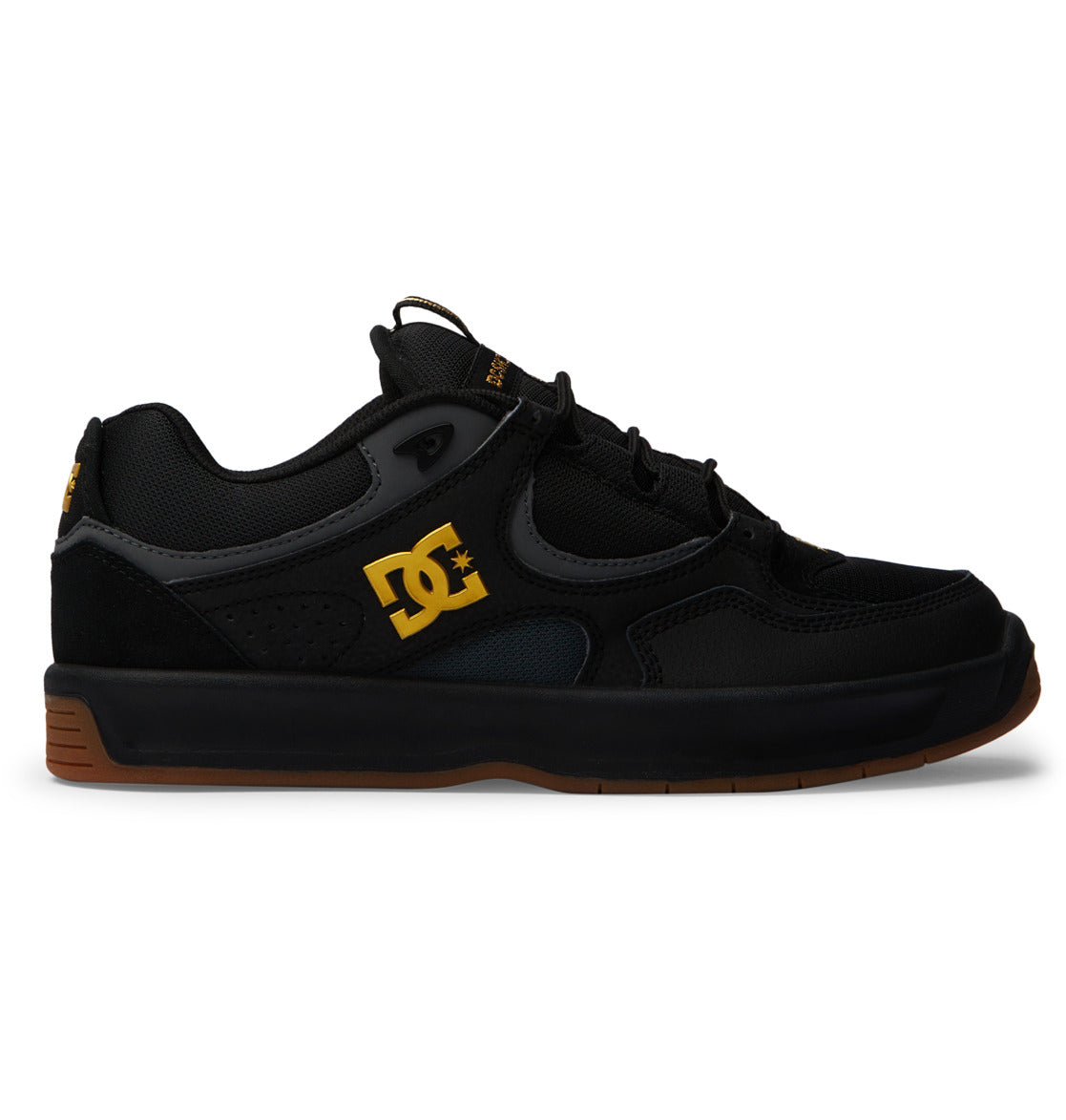 The Men’s Kalynx Zero Shoes by DC Shoes feature a black skate shoe design with yellow DC logo, black laces, mesh and suede panels, low-top silhouette, dark gum sole, plus additional yellow accents on the side and heel—blending classic style with the modern comfort of the Kalynx Zero.