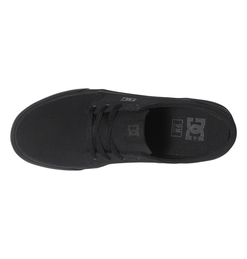 Top view of the DC Shoes Men’s Trase Canvas Shoes in black, featuring laces and visible DC branding on the tongue and insole, with a low-profile silhouette inspired by classic skate style.