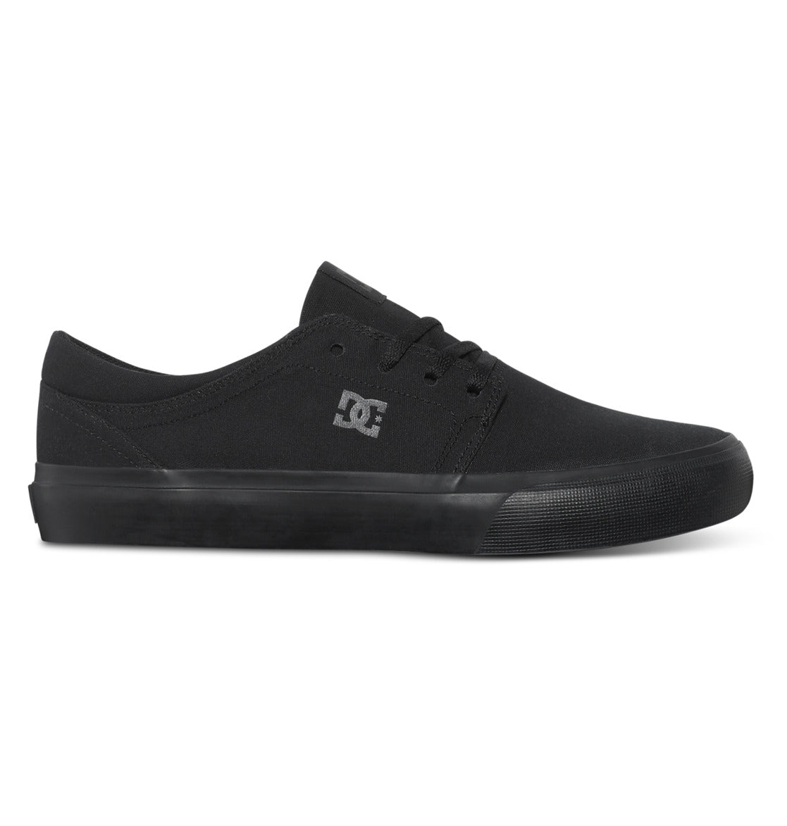 The DC Shoes Men’s Trase Canvas Shoes are black low-top skate shoes with a rubber sole and laces, featuring the signature DC Shoes logo on the side for that classic skate style in a low-profile design.