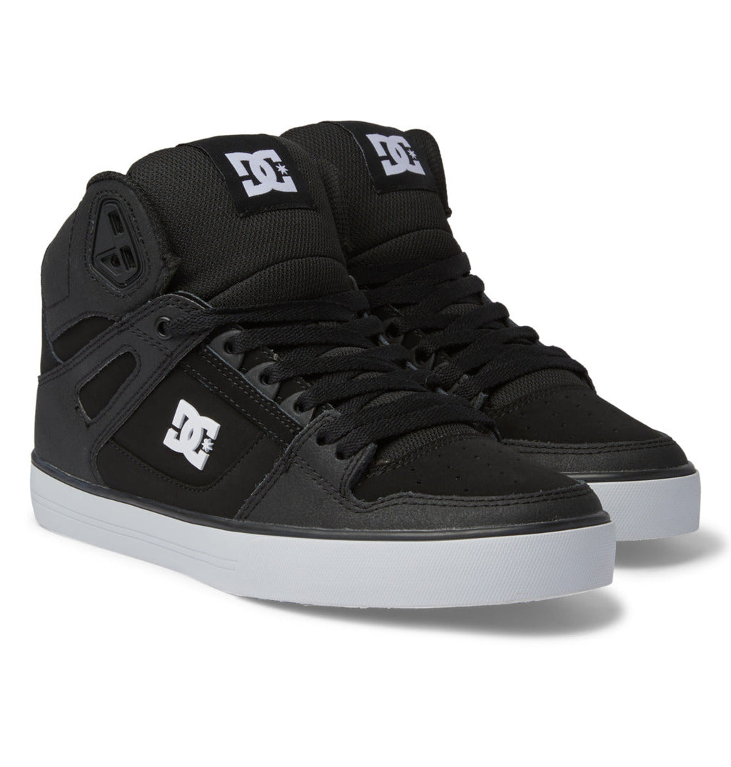 A pair of Men’s Pure High-Top Shoes by DC Shoes in black, featuring white DC logos on the tongue and side, black laces, and white rubber soles, positioned side by side on a white background.