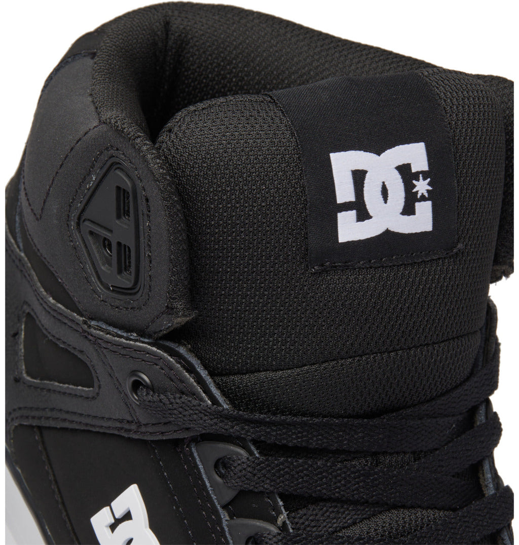 Close-up of a black Men’s Pure High-Top Shoe by DC Shoes, featuring a white DC logo on the tongue and side, black laces, and a padded collar for comfort and durability.