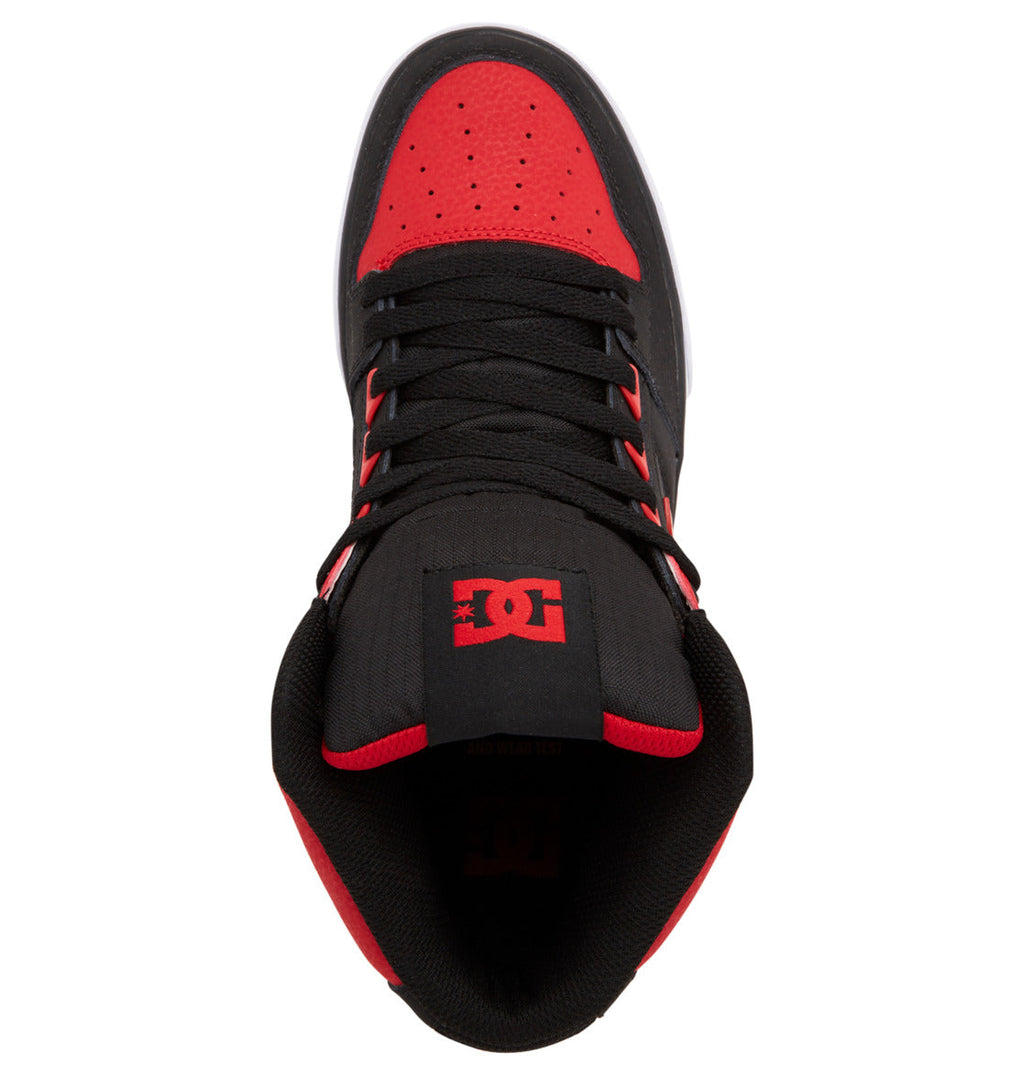 A top view of a black and red Men’s Pure High-Top Shoe by DC Shoes, featuring black laces and the DC Shoes logo on the tongue, designed for comfort and durability.