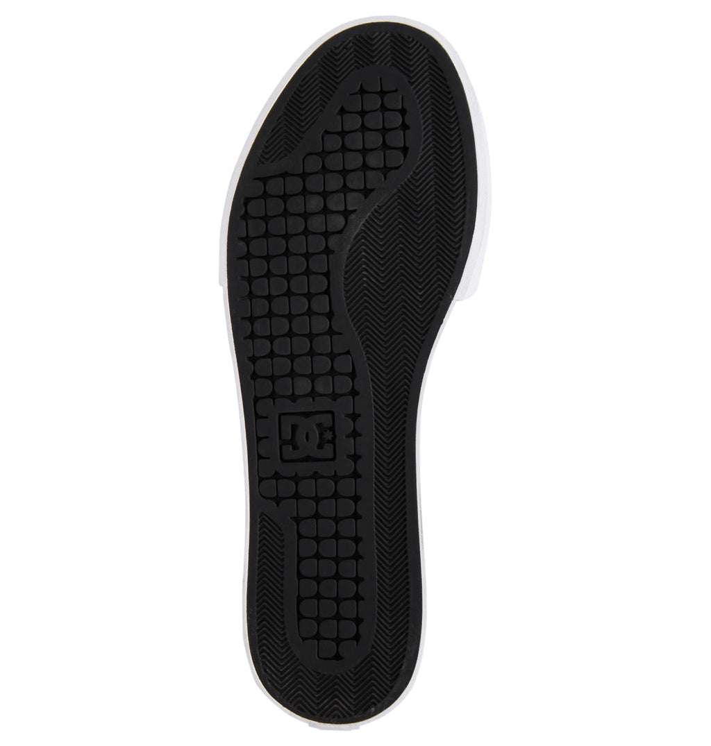 The black sole of the Men’s Pure High-Top Shoe by DC Shoes features a textured tread pattern, with the DC Shoes logo embossed near the arch. The white edge of the sole accentuates its stylish design and suggests the shoe’s durable construction.