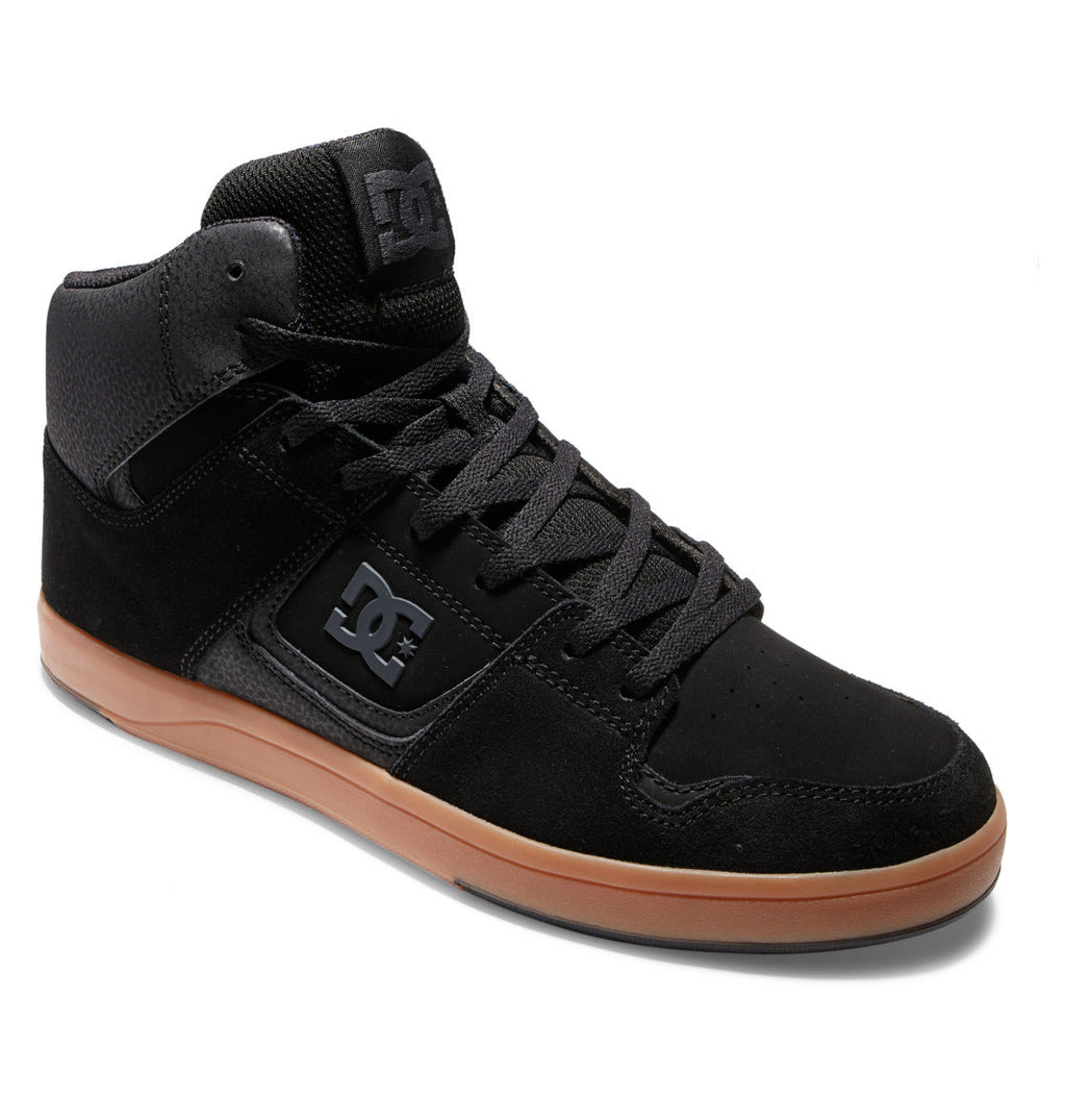 The Men’s DC Pure High-Top Shoes by DC Shoes feature a black high-top design with a gum sole, black laces, and the signature DC logo on the side. These stylish skate shoes combine suede and mesh materials for enhanced durability and comfort.