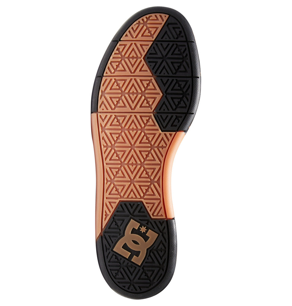 Featuring a geometric, triangular tread pattern in black and orange with a stylized DC logo near the heel, the sole is a signature detail of the Men’s DC Pure High-Top Shoes by DC Shoes.