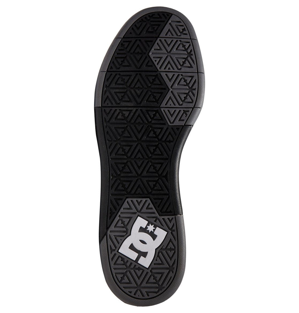 The Men’s DC Cure Shoes by DC Shoes feature a black sole with a geometric triangular tread pattern for durable grip and everyday style, highlighted by a white DC Shoes logo near the heel. Crafted with premium leather nubuck materials, these shoes provide lasting comfort and enhance the sleek design.
