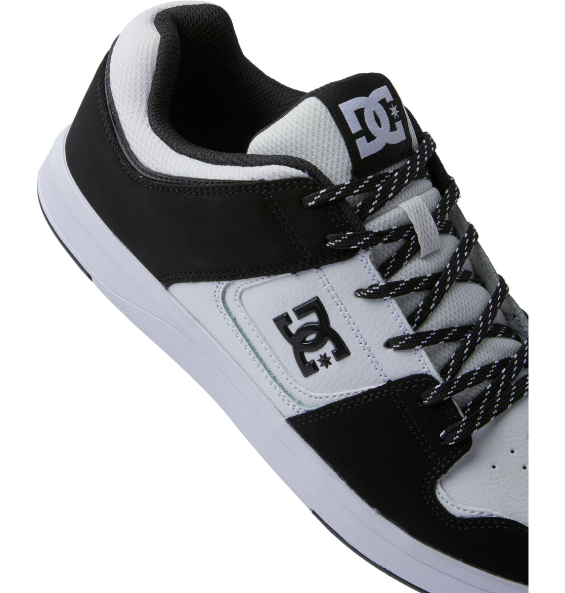 The Men’s DC Cure Shoes by DC Shoes feature a black and white colorway, leather upper, mesh tongue, signature logos on the side and tongue, and patterned black-and-white laces—ideal for everyday wear—shown from an angled overhead view.