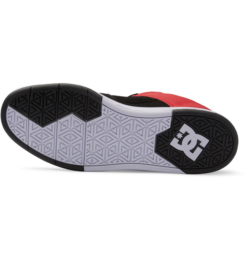 The image displays the sole of the Men’s DC Cure Shoes by DC Shoes, showcasing a geometric pattern in white and gray, with black accents on the heel and toe, and the DC Shoes logo in white near the heel. This design is crafted to complement a leather upper, making these shoes ideal for everyday wear.