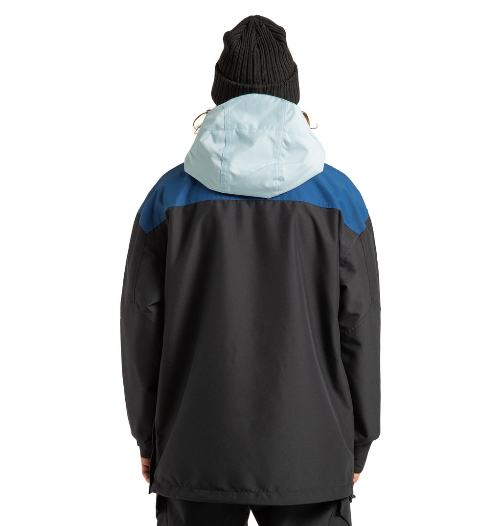 A person wearing a black beanie and the Men’s DC-43 Anorak Jacket by DC Shoes, featuring a light blue hood and blue shoulders, is pictured facing away from the camera against a white background. Designed for outdoor adventure, this jacket combines comfort and style from DC Shoes, making it an ideal choice for brisk days.