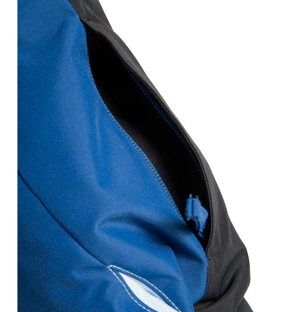 A close-up of a partially open zipper pocket on the DC Shoes Men’s Defiant Insulated Jacket in blue and black fabric, showing the zipper pull inside.