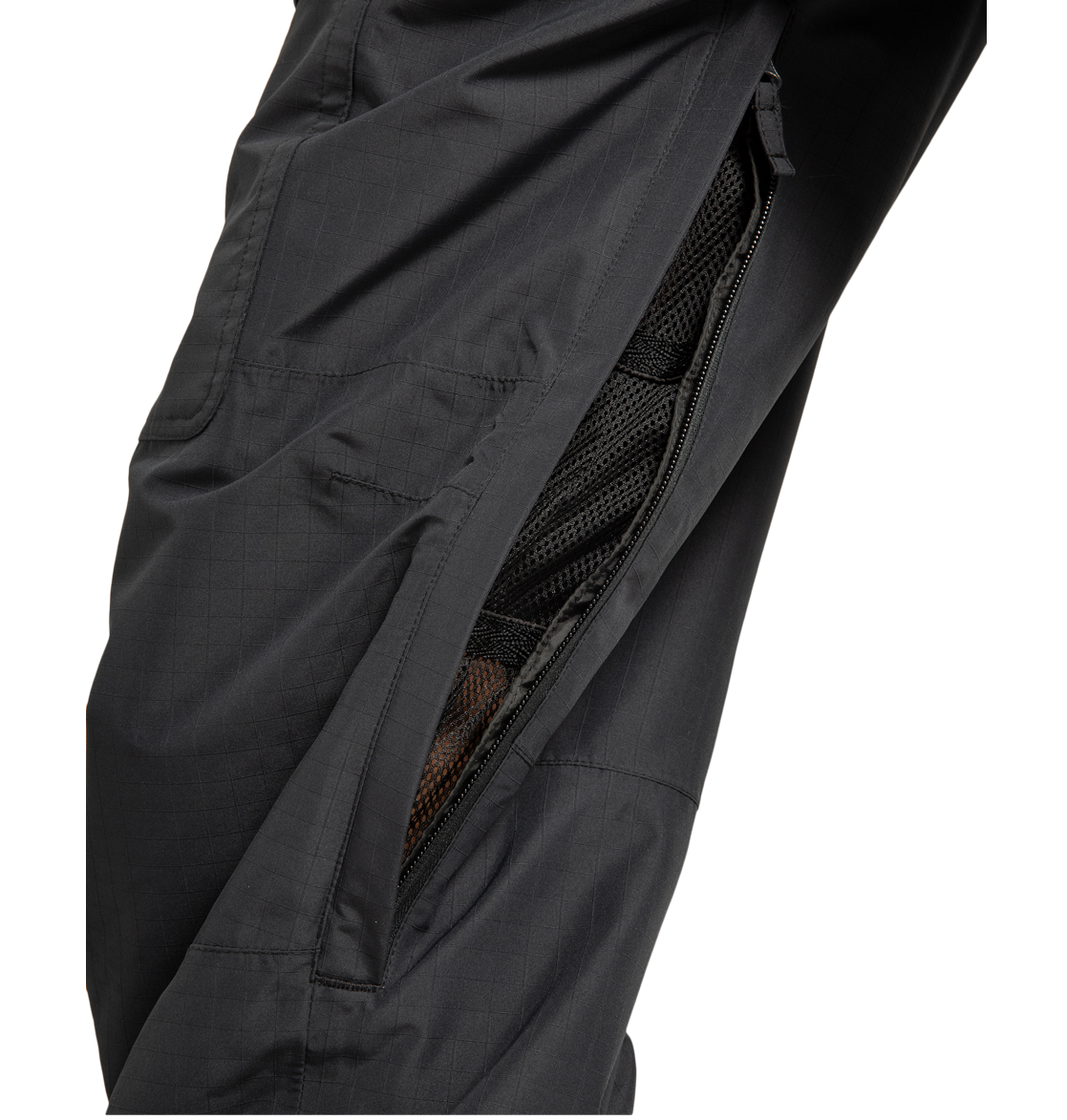 Close-up of the DC Shoes Men’s Code Shell Pants in black, showcasing a partially unzipped side vent that reveals a mesh lining beneath. The fabric’s subtle grid pattern emphasizes the technical design and eco-friendly construction of these pants.