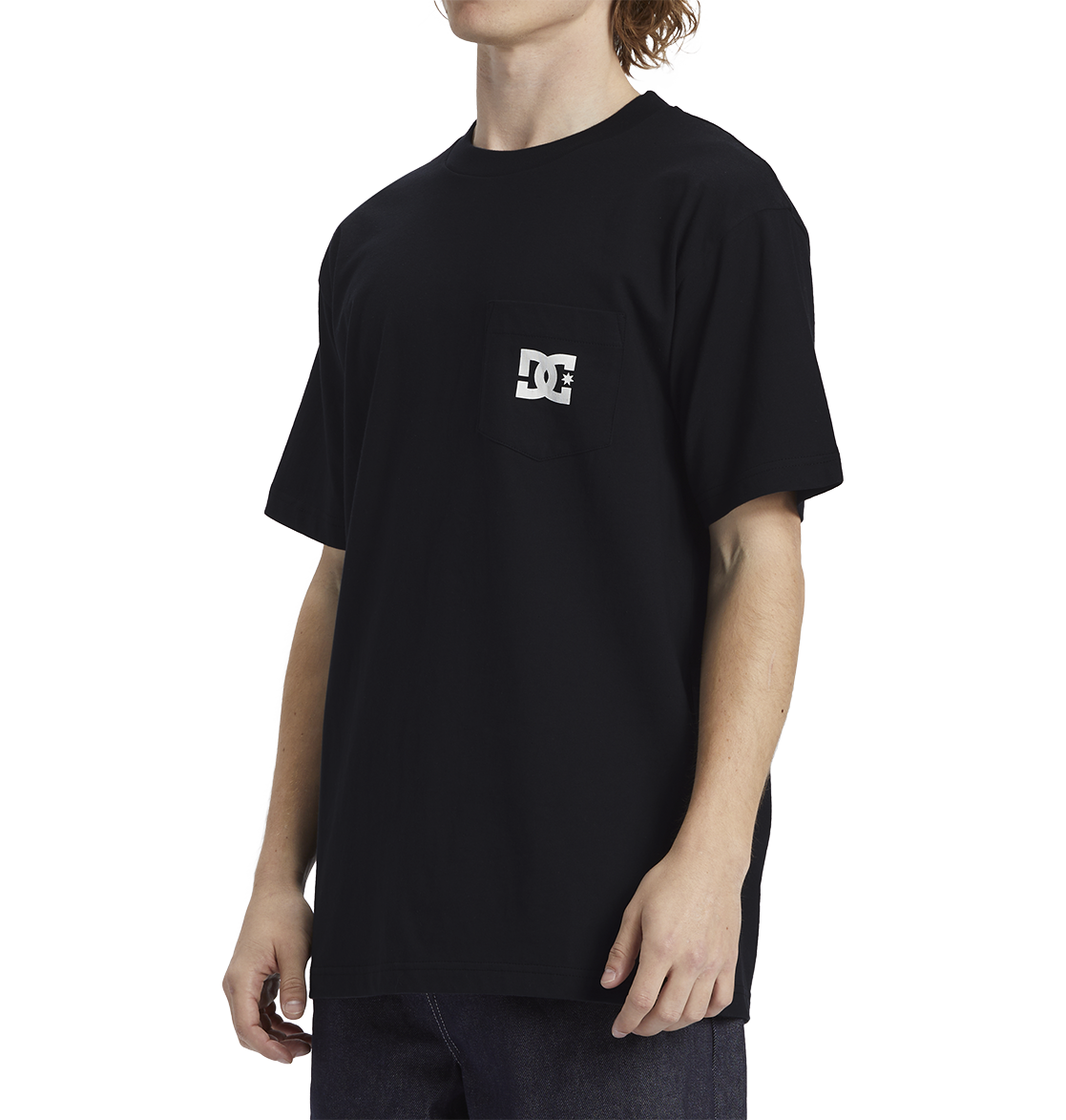 A person wearing the Men's DC Star Pocket Tee by DC Shoes, featuring a relaxed fit and small white logo on the chest pocket, stands against a plain white background paired with dark jeans.