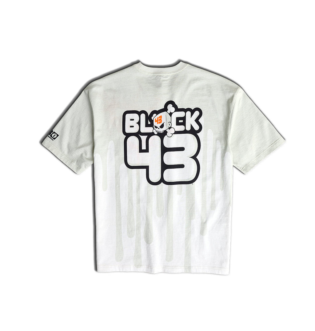 The Men’s Big Drip HSS T-Shirt by DC Shoes is a white tee featuring BLOCK 43 and a cartoon bear graphic with vertical drips inspired by Ken Block’s iconic Drips livery on the back, plus a small logo patch on the left sleeve.