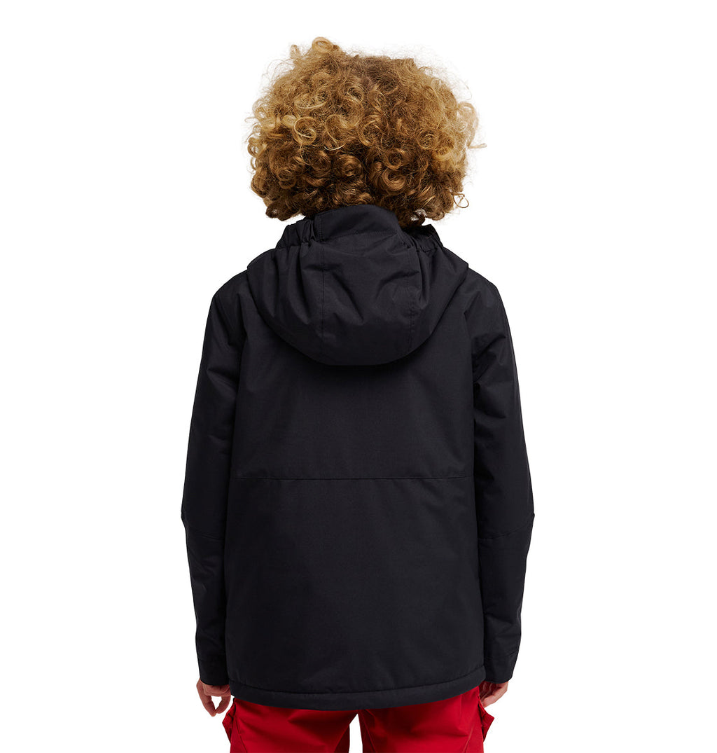 A person with curly hair is seen from behind, wearing the DC Shoes Basis Youth Jacket in black and red pants, standing against a white background.