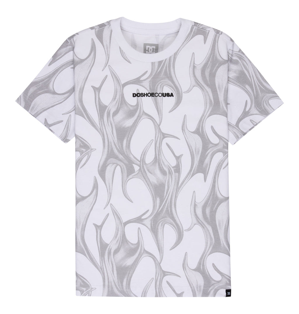 The Reebok DC Liquid Fuego Hss Youth is a white short-sleeve t-shirt featuring gray abstract flame patterns and "DCSHOECOUSA" in bold black text centered on the chest.