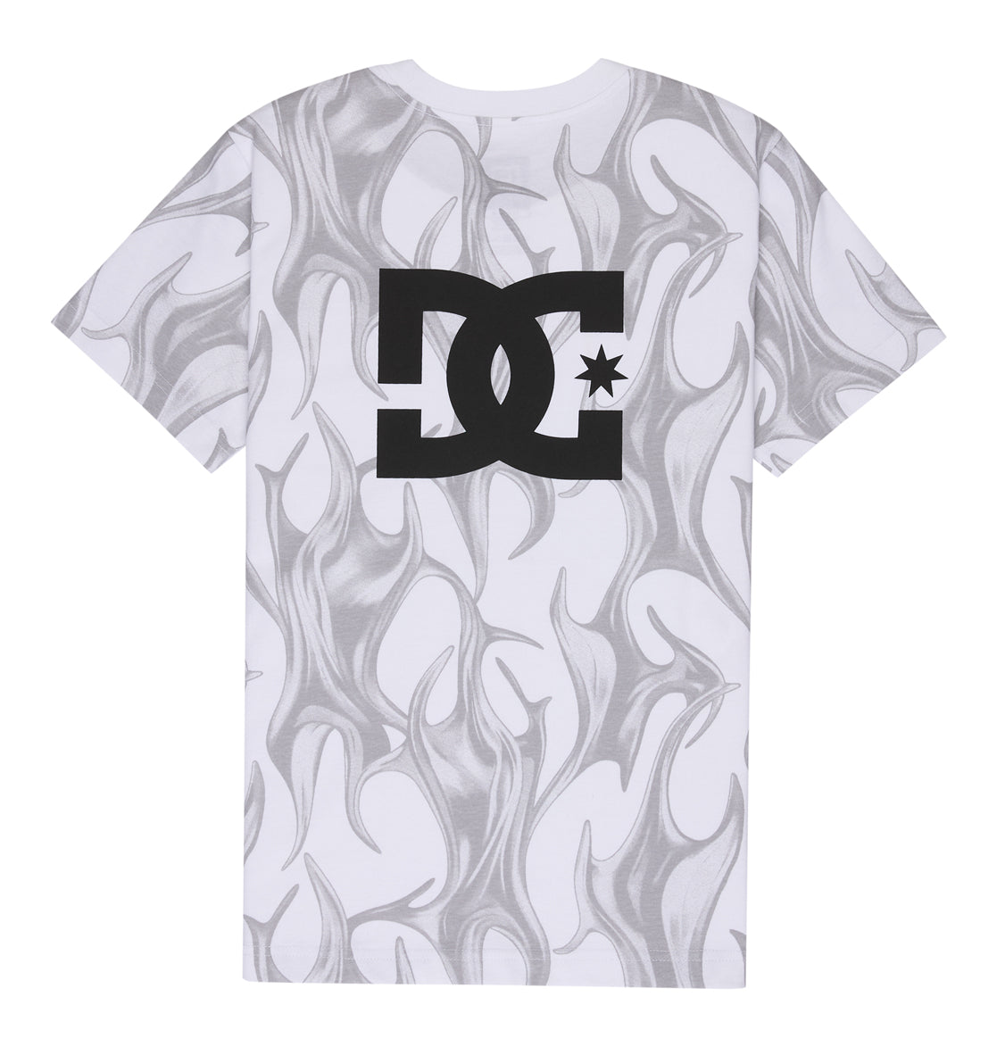 The Reebok DC Liquid Fuego Hss Youth is a white T-shirt featuring a gray abstract flame design and a large black DC logo with a star in the center on the back.