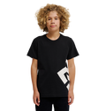 A young person with curly blonde hair wears the DC Shoes DC Lanai Tee Youth, a black relaxed-fit skate shirt with a bold white graphic on one side, standing against a plain white background.