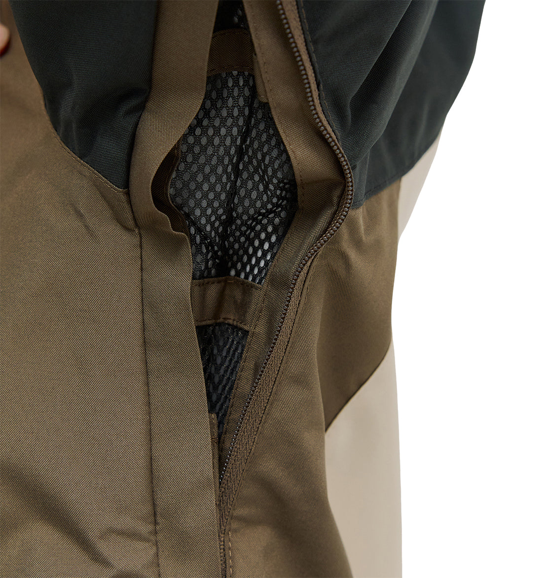 Close-up of the Everfrost Jacket by DC Shoes in brown and black, highlighting an unzipped vent with black mesh lining inside.