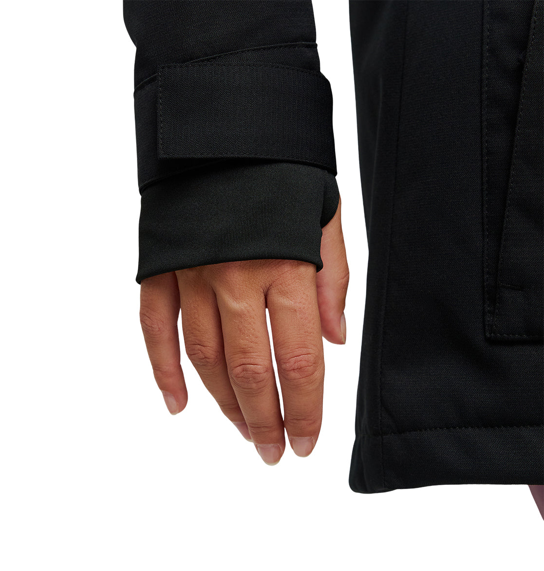 A close-up of a person’s left hand, partially covered by the sleeve of a black DC Shoes Cruiser Jacket featuring a Velcro wrist strap. The fingers are relaxed and the background is white.