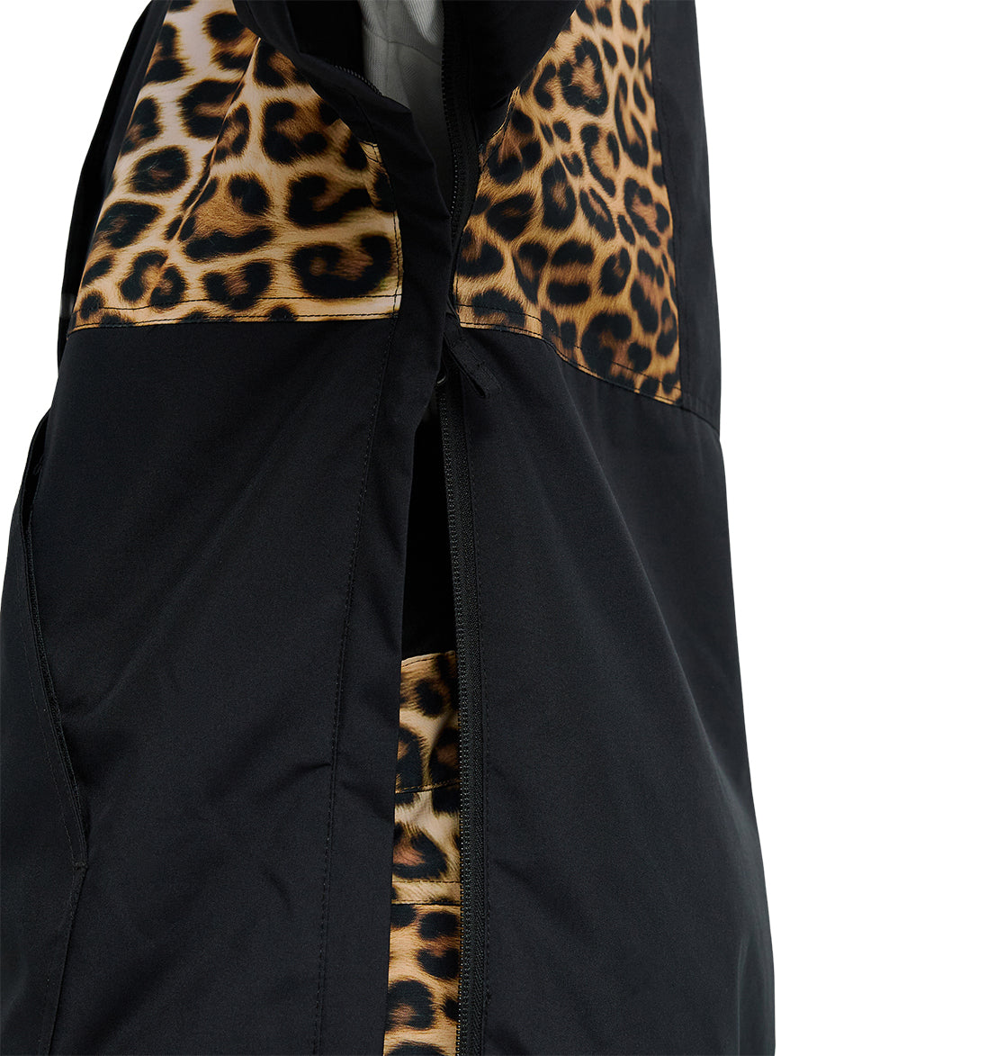 Close-up of a black DC Shoes Chalet Anorak featuring leopard print accents on the chest and inside the zipper area, displayed against a plain white background.