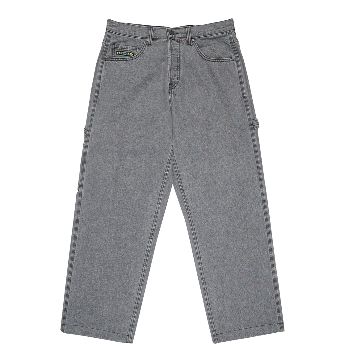 The DC Shoes Men's Baggy Denim Carpenter Pant in gray features a relaxed, wide-leg fit, five pockets, belt loops, and a small green and black label on the right front pocket, shown flat on a white background.