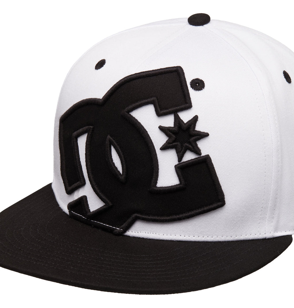 The Reebok DC Double That Cap is a white snapback with a black brim and a bold black DC logo on the front.