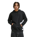 A young man with short, braided hair wears the DC Shoes Lanai Ph black hoodie with a front pocket and subtle white graphic on the side, standing with hands in the pocket and facing forward.