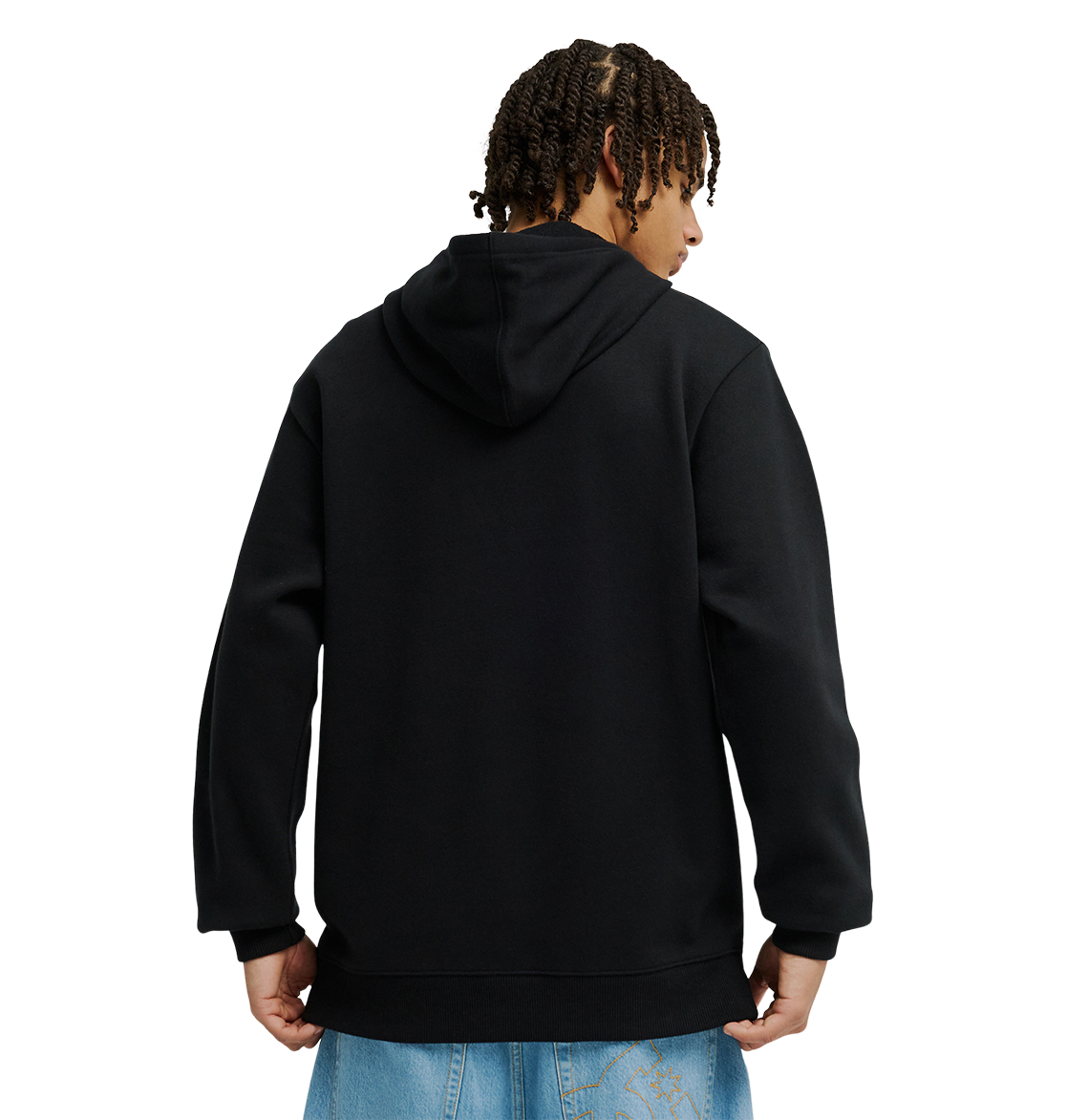 A person with short, curly hair is seen from behind wearing the Men’s DC Strass Star Hoodie by DC Shoes—a black pullover featuring a rhinestone DC star—paired with light blue jeans, standing against a plain white background.