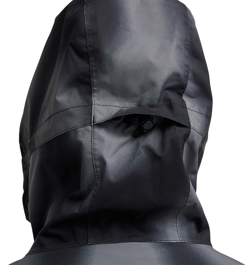 A close-up of the back of the DC Shoes Basis Jacket 10K in dark gray highlights a seam running across the hood and features a small black adjustment toggle at the center.