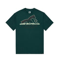 The Men’s Slathletic Heritage Short Sleeve Shirt by DC Shoes is crafted from recycled cotton in dark green, featuring a large DC Shoes logo along with “athletics DCSHOECOUSA 1994” printed in beige and light green across the chest.